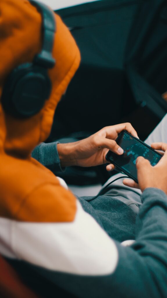 gamer influencer playing mobile game on the phone